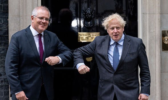 Boris Johnson alongside Australian Prime Minister Scott Morrison (Image: GETTY)
