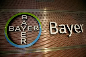 BAYER’S MONSANTO UNIT FILES A PROPOSED U.S. CLASS SETTLEMENT